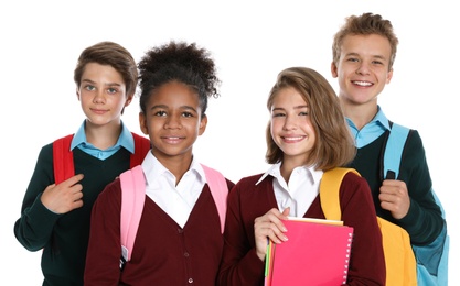 Happy pupils in school uniform on white background