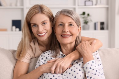 Happy mature mother and her daughter at home