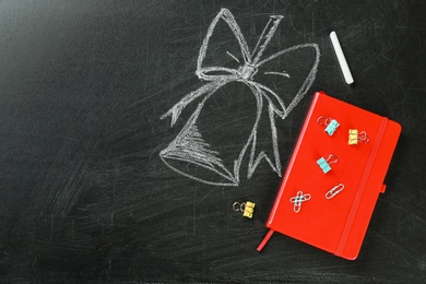 Flat lay composition for Teacher's day on chalkboard