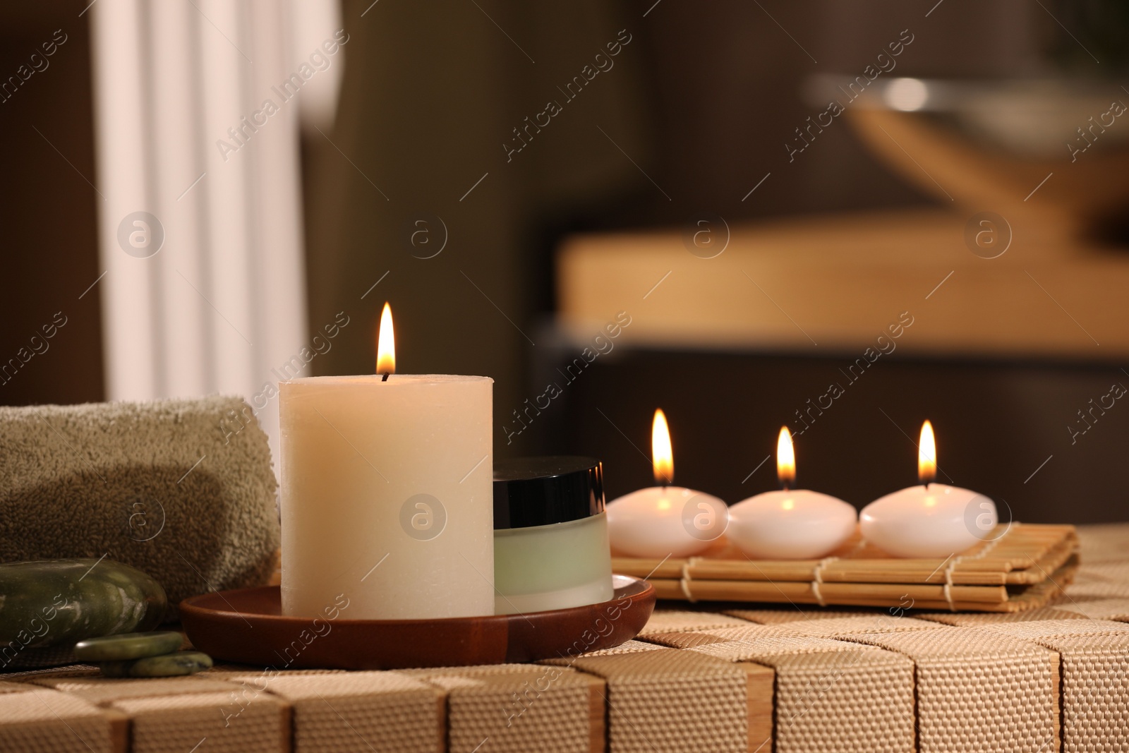 Photo of Beautiful composition with different spa products on wicker bench indoors