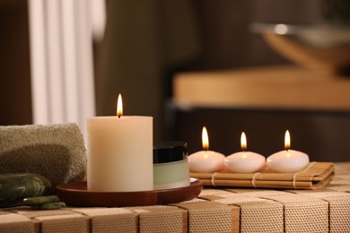 Beautiful composition with different spa products on wicker bench indoors