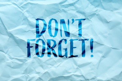 Image of Phrase Don;t forget written on crumpled blue paper