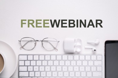 Image of FREE WEBINAR. Flat lay composition with computer keyboard and smartphone on white table