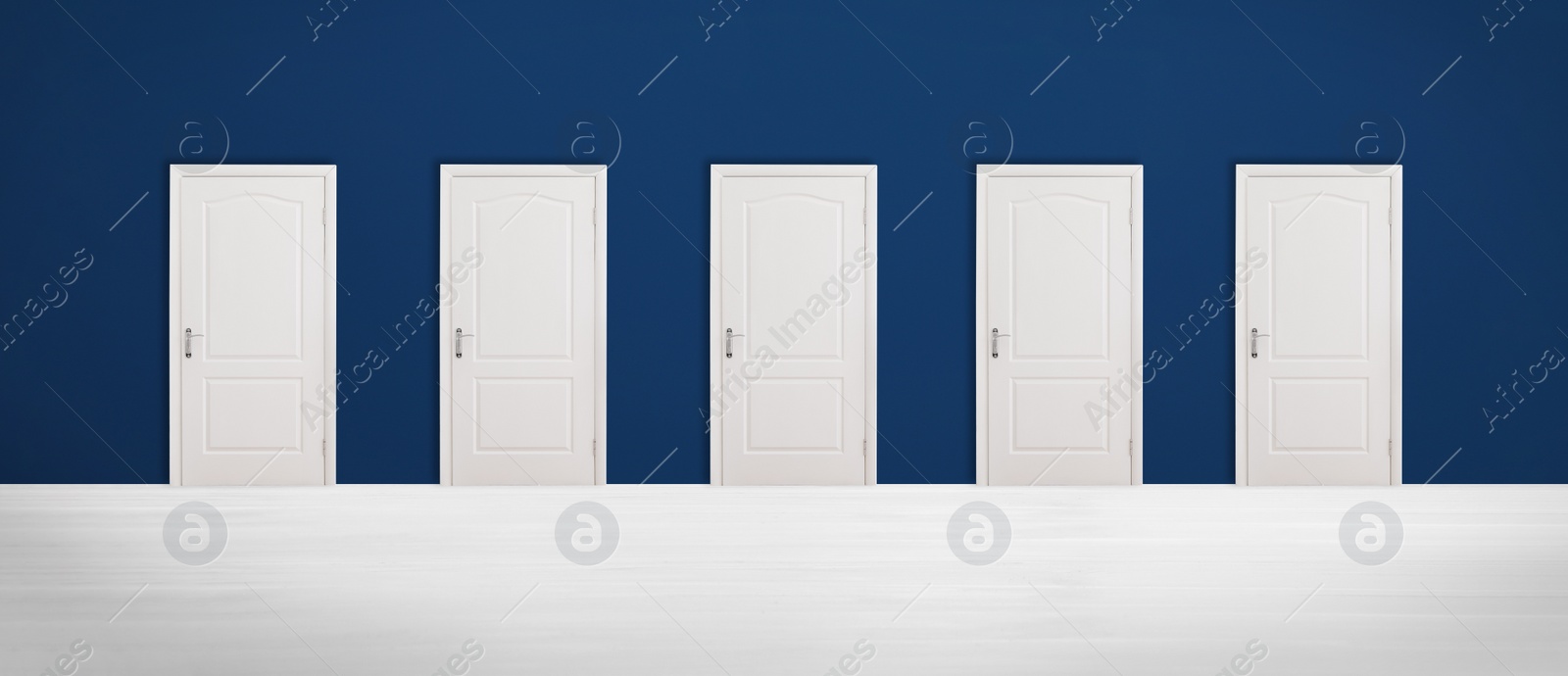 Image of Many closed doors in room. Concept of choice