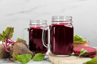 Photo of Freshly made beet juice on white table