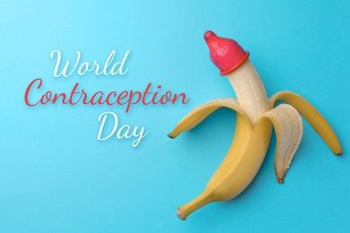 World contraception day. Banana with condom on turquoise background, top view