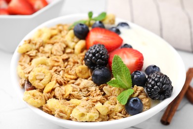 Tasty oatmeal, yogurt and fresh berries in bowl, closeup. Healthy breakfast