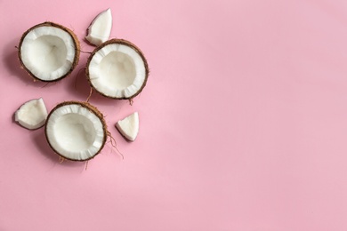 Photo of Flat lay composition with coconuts on color background. Space for text