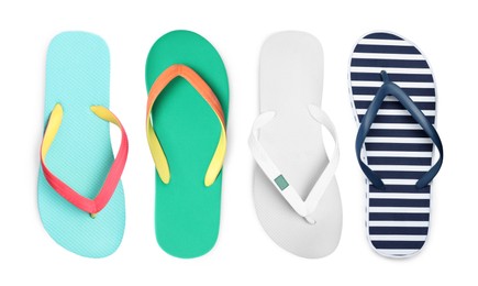 Image of Set with different flip flops on white background, top view