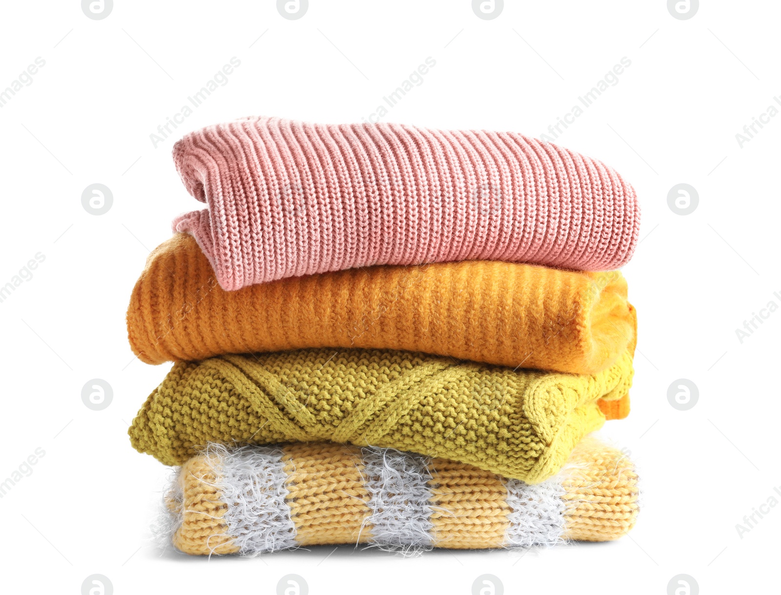 Photo of Stack of warm knitted clothes on white background