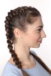 Woman with braided hair on white background