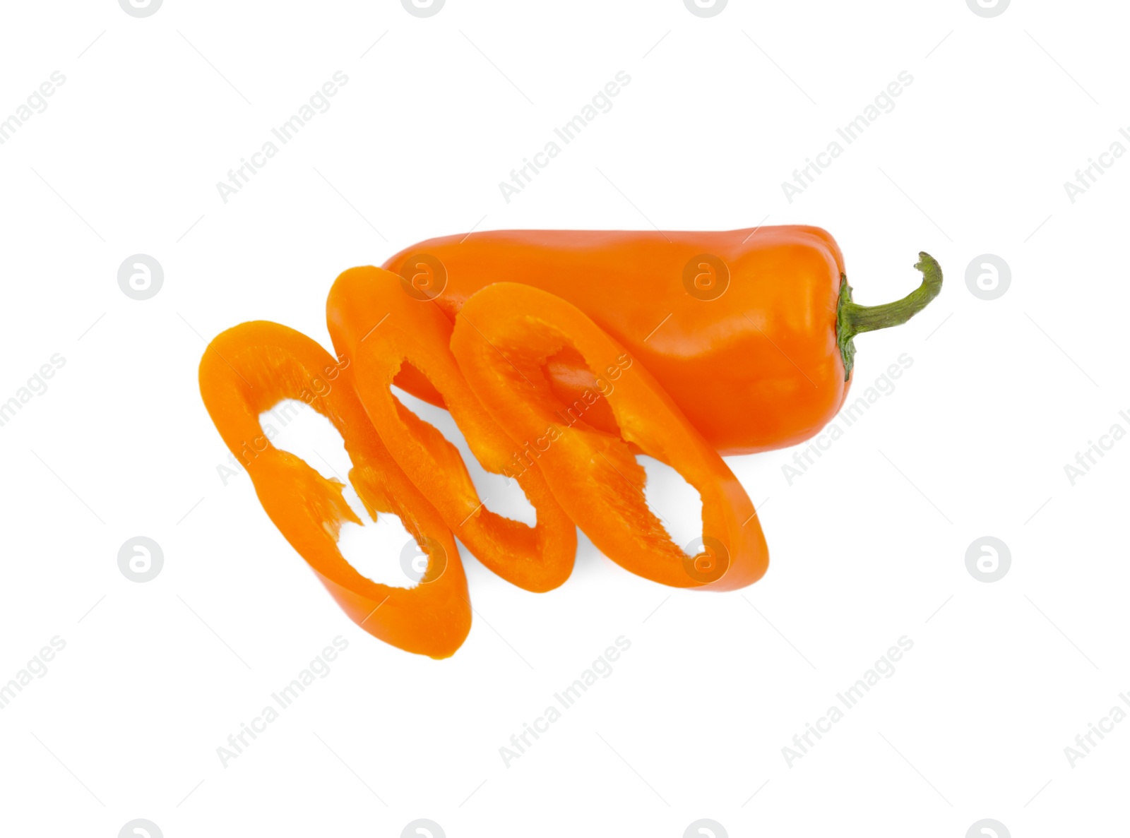 Photo of Cut and whole orange hot chili peppers isolated on white, top view