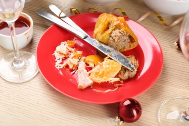 Photo of Food leftovers after party on wooden table, closeup