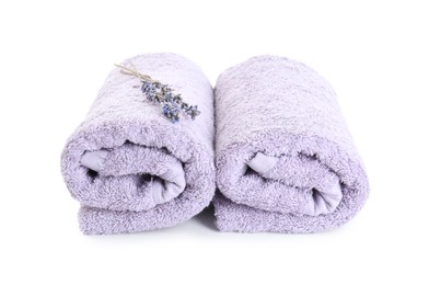 Rolled violet terry towels and dry lavender isolated on white