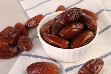 Tasty sweet dried dates on light grey table, closeup