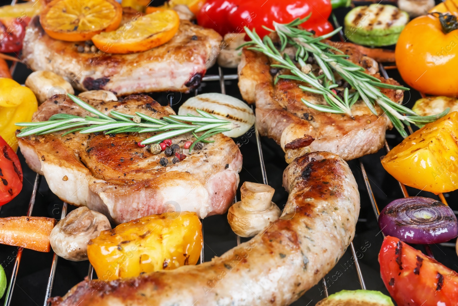 Photo of Modern barbecue grill with tasty food, closeup