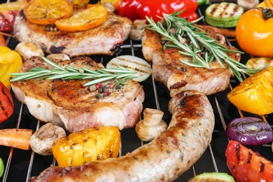 Photo of Modern barbecue grill with tasty food, closeup