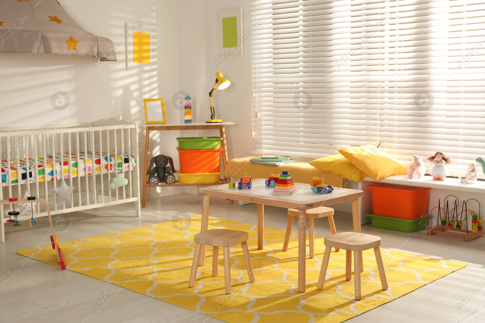 Photo of Cozy baby room interior with comfortable crib