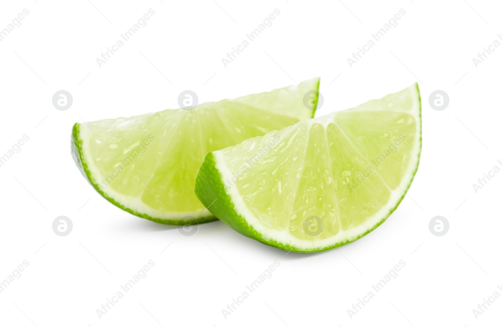 Photo of Citrus fruit. Slices of fresh lime isolated on white