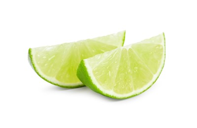 Photo of Citrus fruit. Slices of fresh lime isolated on white