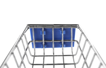 Photo of Empty shopping trolley isolated on white, closeup