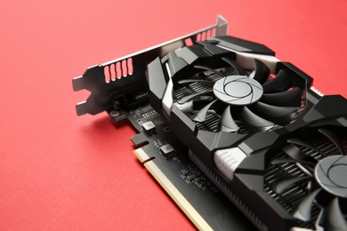 Photo of Computer graphics card on red background, closeup