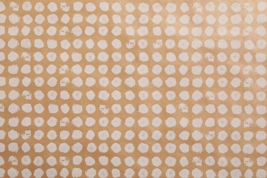 Photo of Color paper sheet with stylish pattern as background, top view