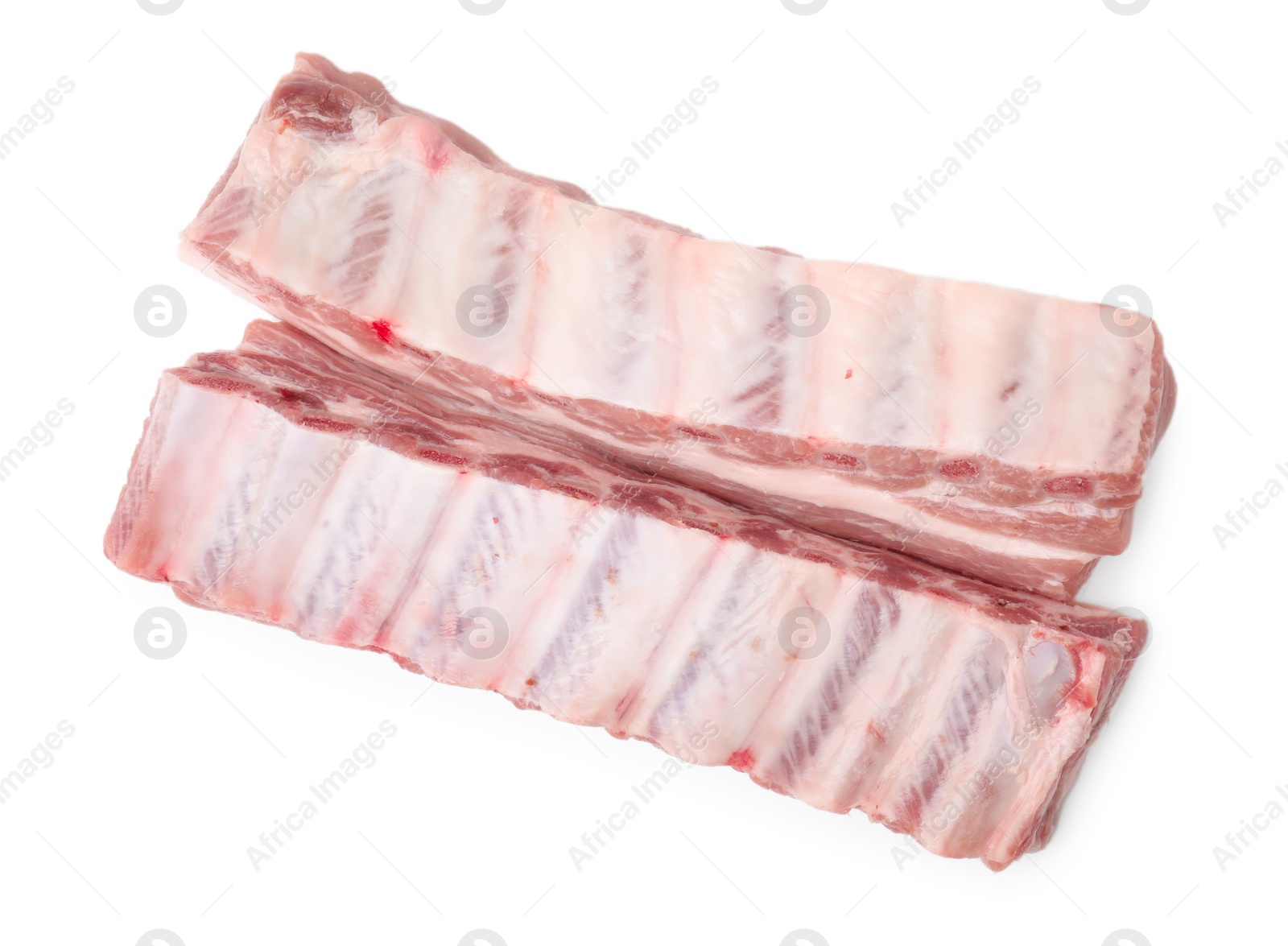 Photo of Raw pork ribs isolated on white, top view