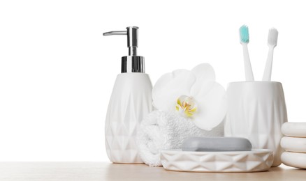 Bath accessories. Different personal care products and flower on wooden table against white background. Space for text