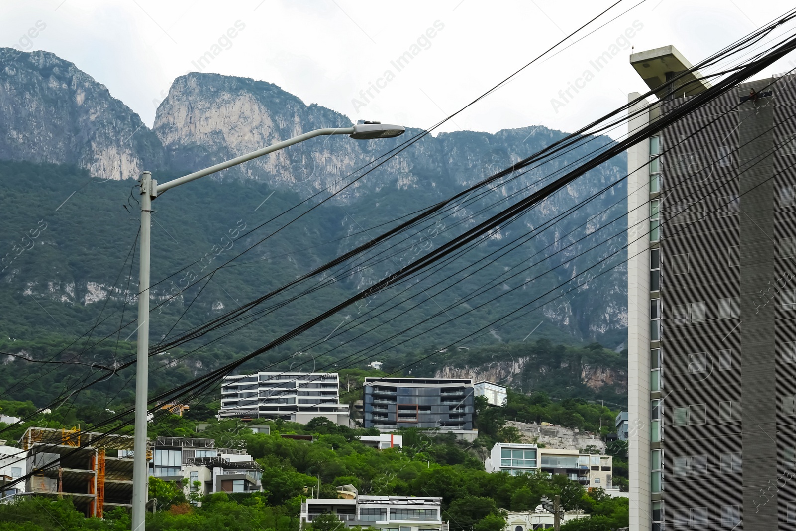 Photo of Beautiful view of city and green mountains