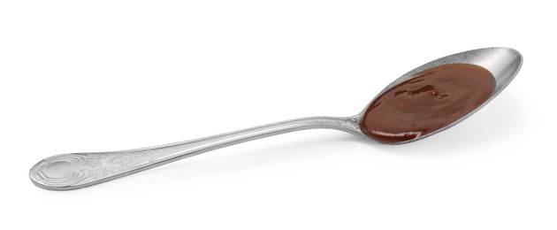 Photo of Tasty barbecue sauce in spoon isolated on white