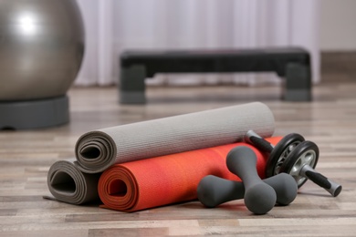 Set of fitness equipment on floor indoors