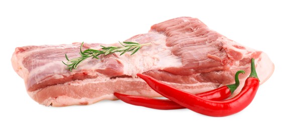 Photo of One piece of raw pork belly, chili pepper and rosemary isolated on white