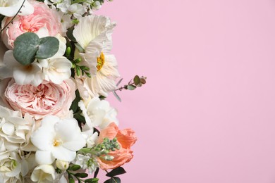 Bouquet of beautiful flowers on pink background, closeup. Space for text