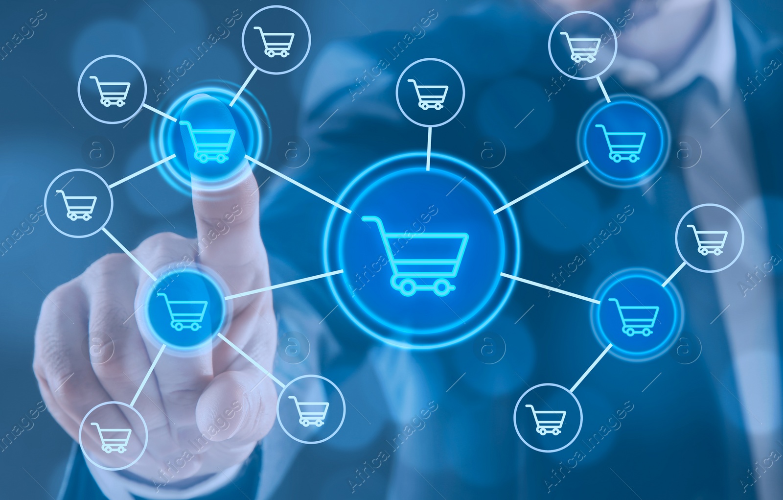 Image of Man pointing at icons of shopping carts on virtual screen, closeup. Online store