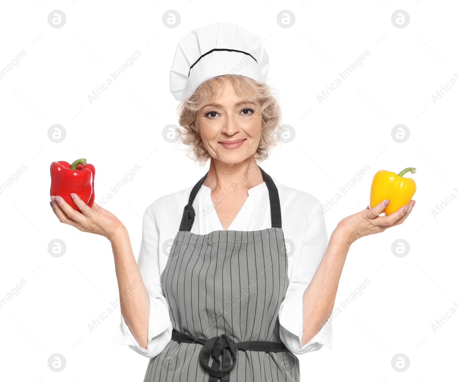 Photo of Professional chef with peppers on white background