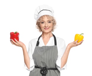 Professional chef with peppers on white background