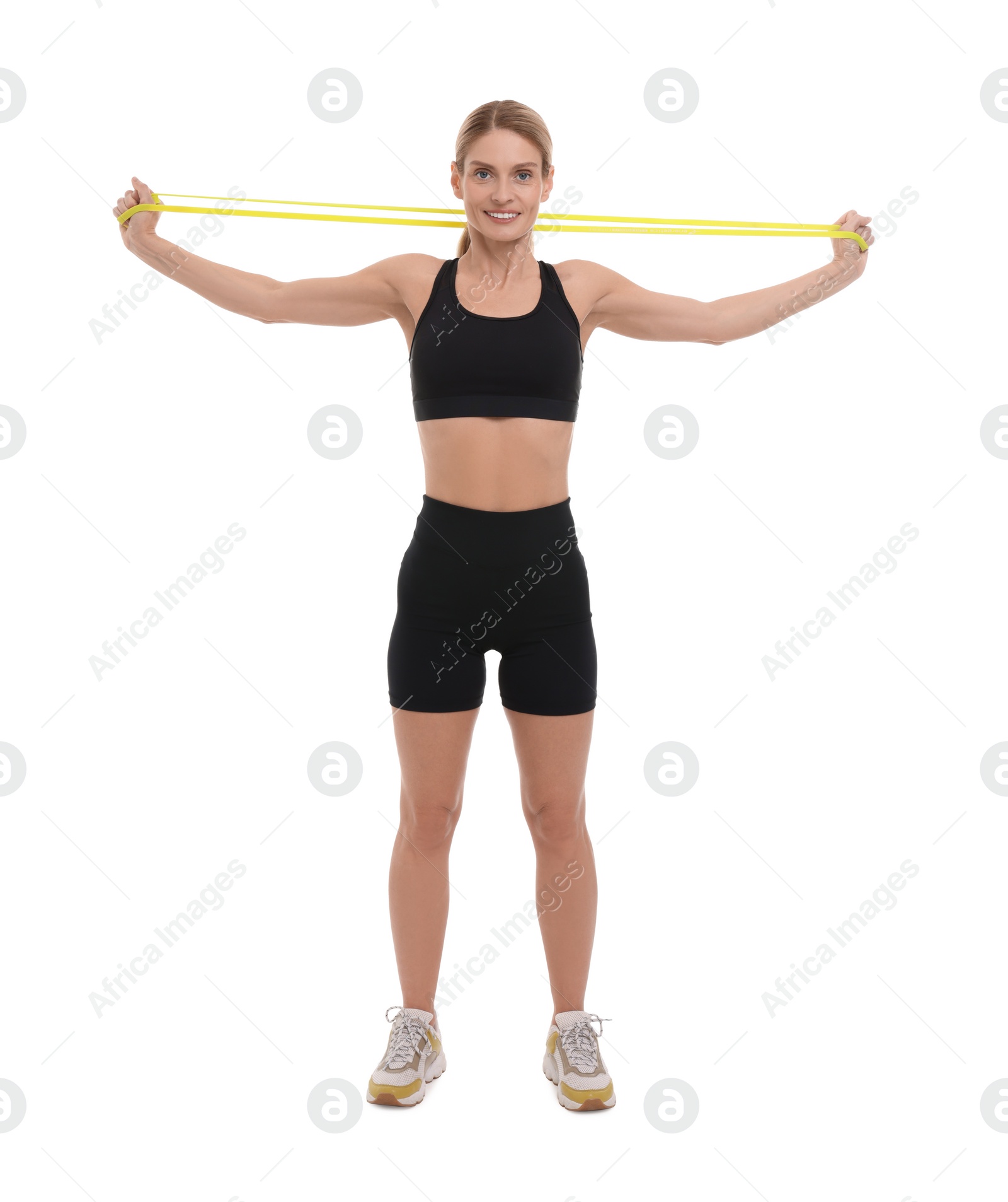 Photo of Woman exercising with elastic resistance band on white background