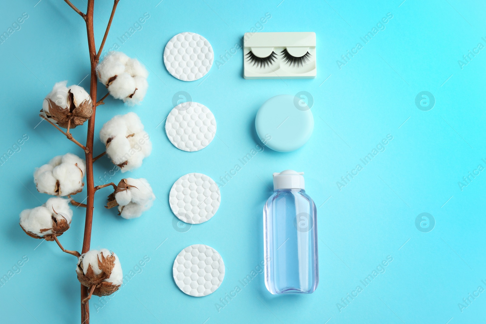 Photo of Flat lay composition with cotton pads on color background. Space for text