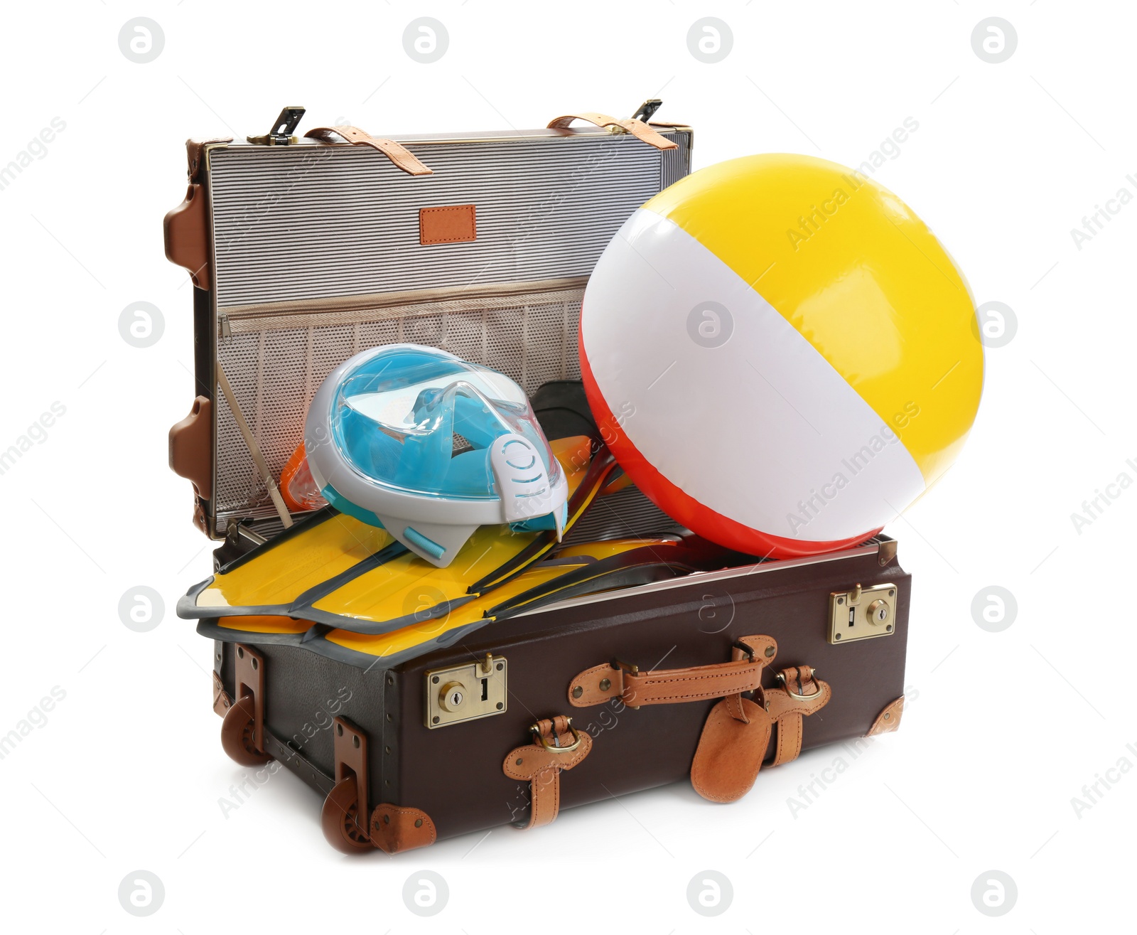 Photo of Open suitcase with beach accessories  on white background