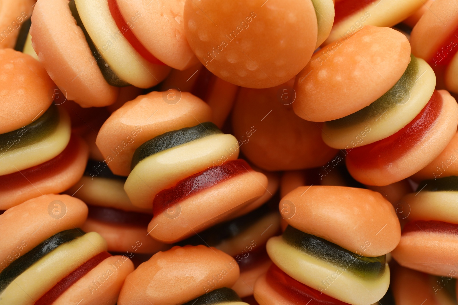 Photo of Tasty jelly candies in shape of burger, closeup