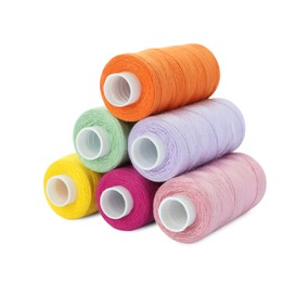 Photo of Different colorful sewing threads on white background