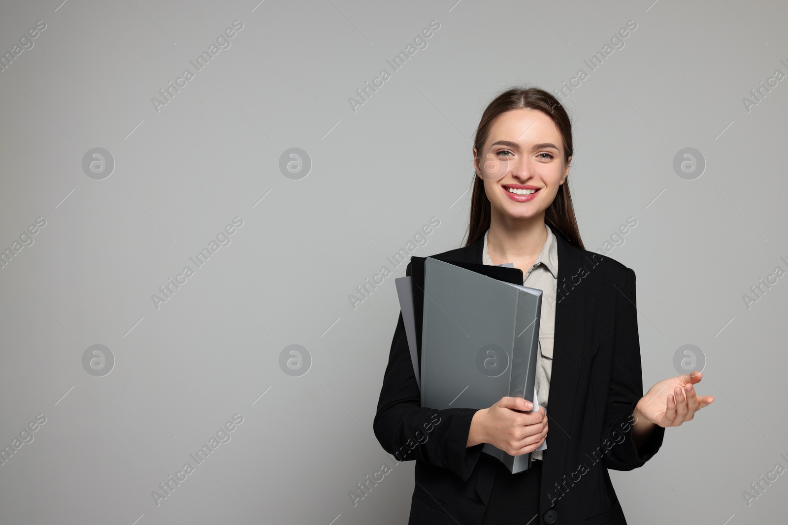 Photo of Portrait of beautiful young teacher on grey background. Space for text