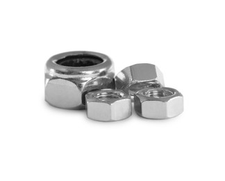 Different metal hex nuts on white background