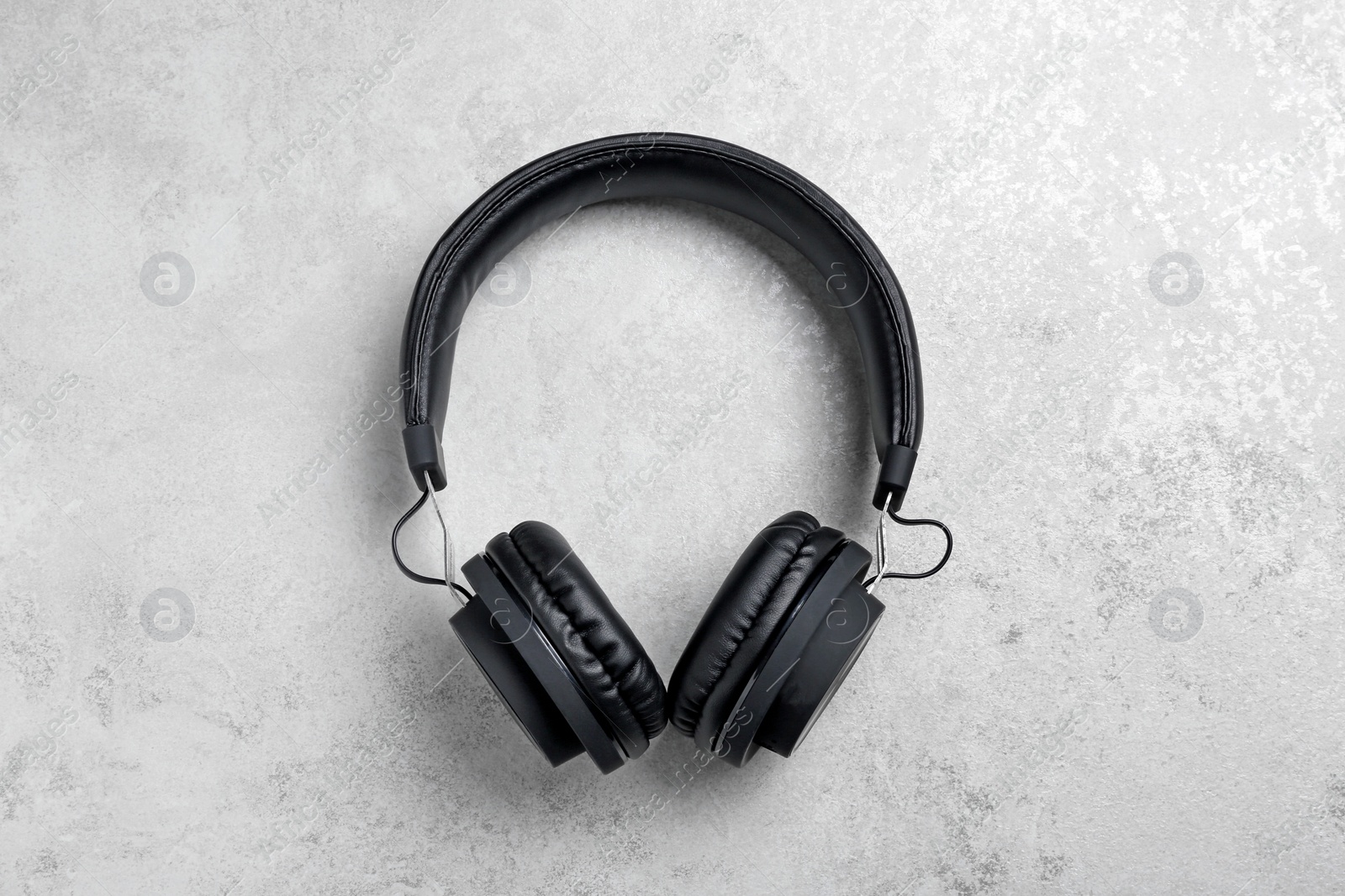 Photo of Stylish headphones on grey background, top view