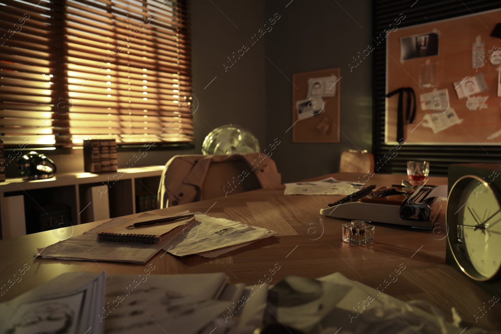 Photo of Detective workplace with vintage typewriter and inkwell