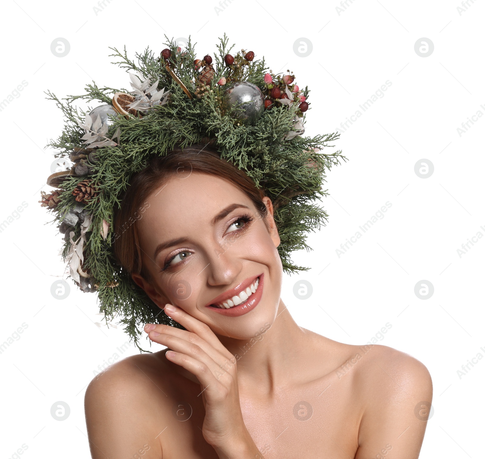 Photo of Beautiful young woman wearing Christmas wreath on white background