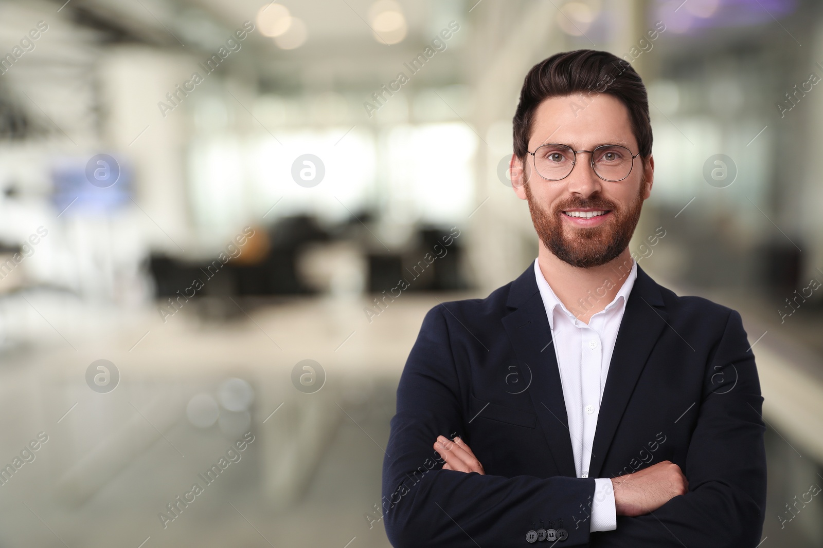Image of Handsome confident man with eyeglasses in office, space for text
