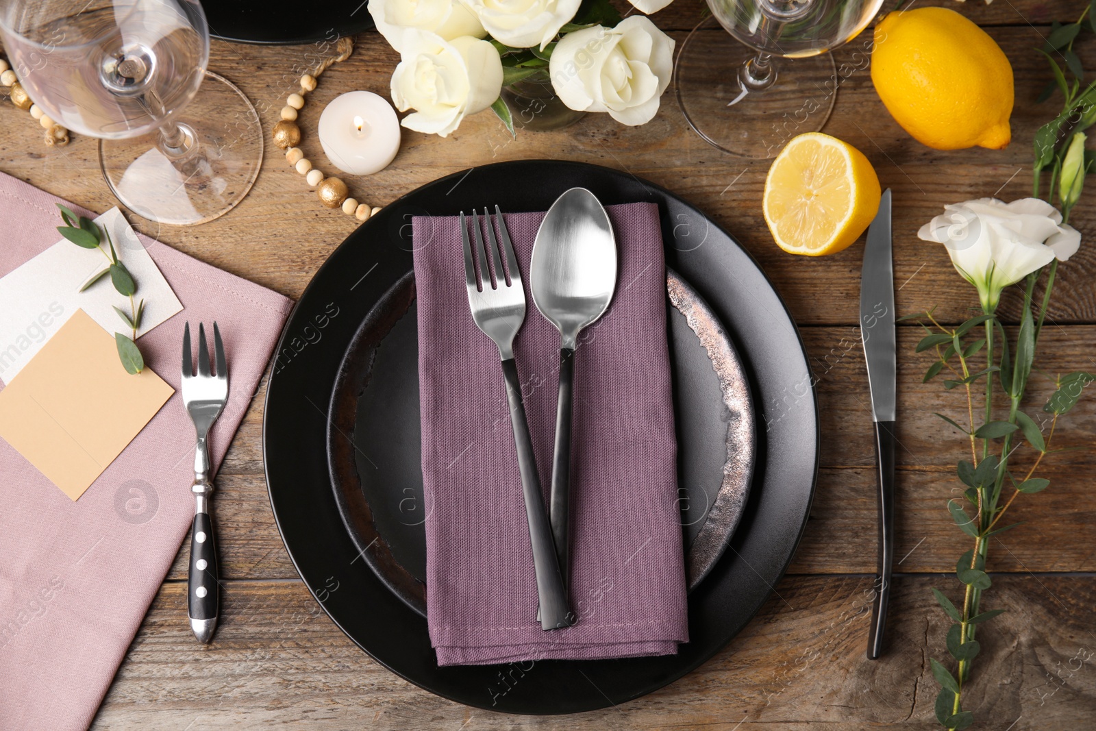 Photo of Elegant festive table setting on wooden background, flat lay