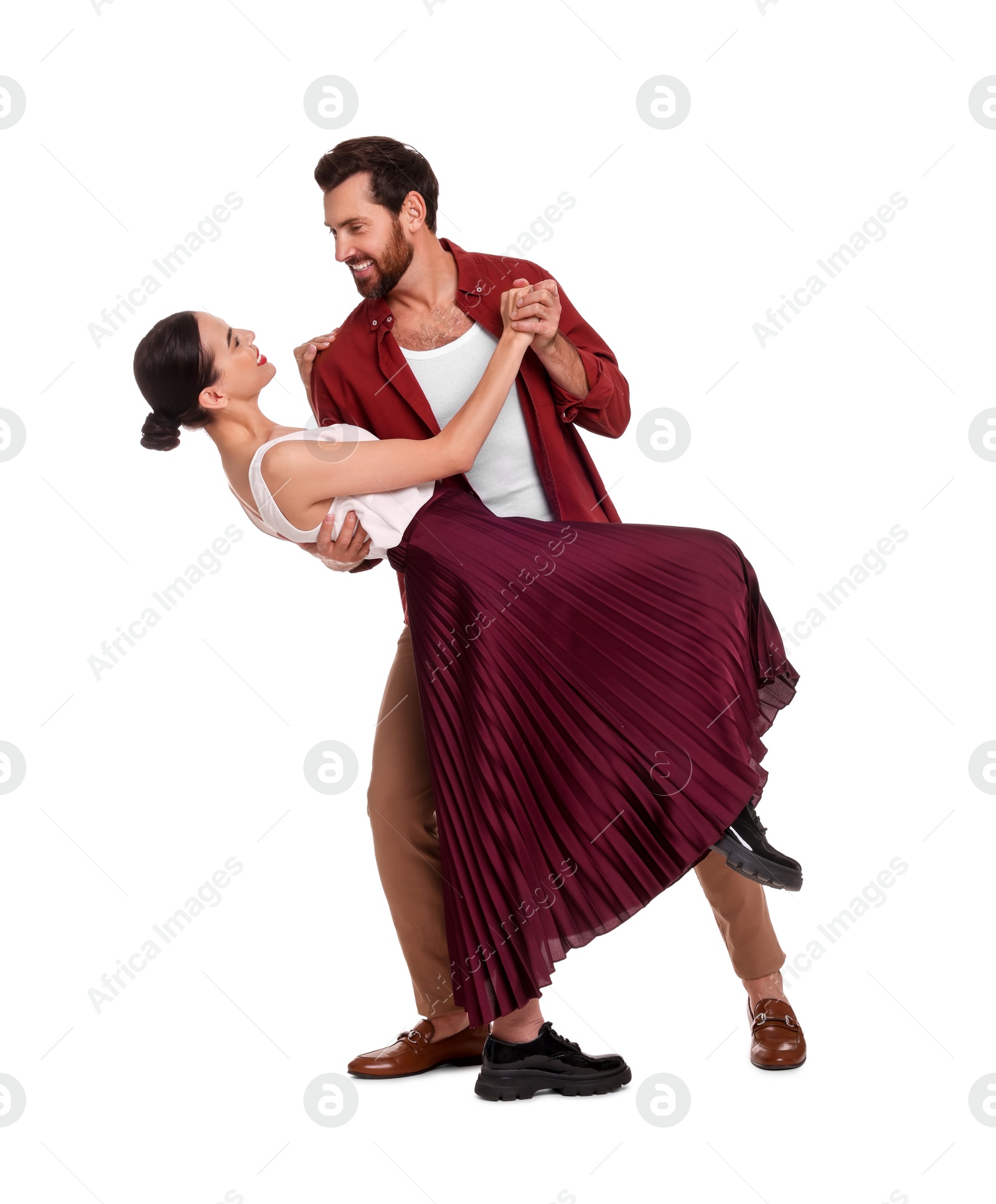 Photo of Happy couple dancing together on white background